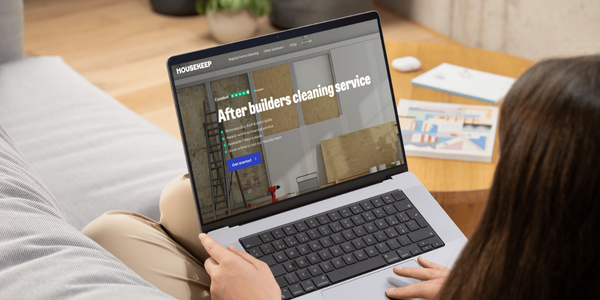 Women booking after builders cleaning on laptop