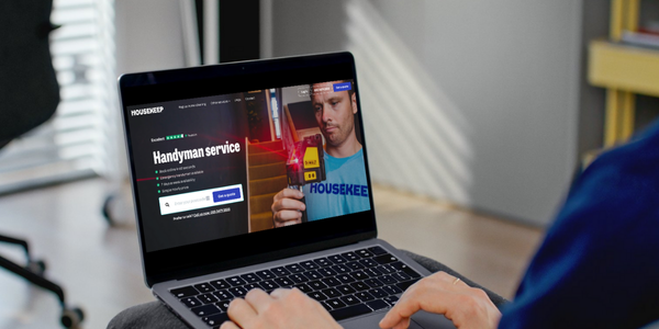 Person booking a handyman through the Housekeep website on their laptop