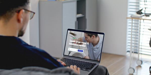 Man booking a tumble dryer repair through the Housekeep website